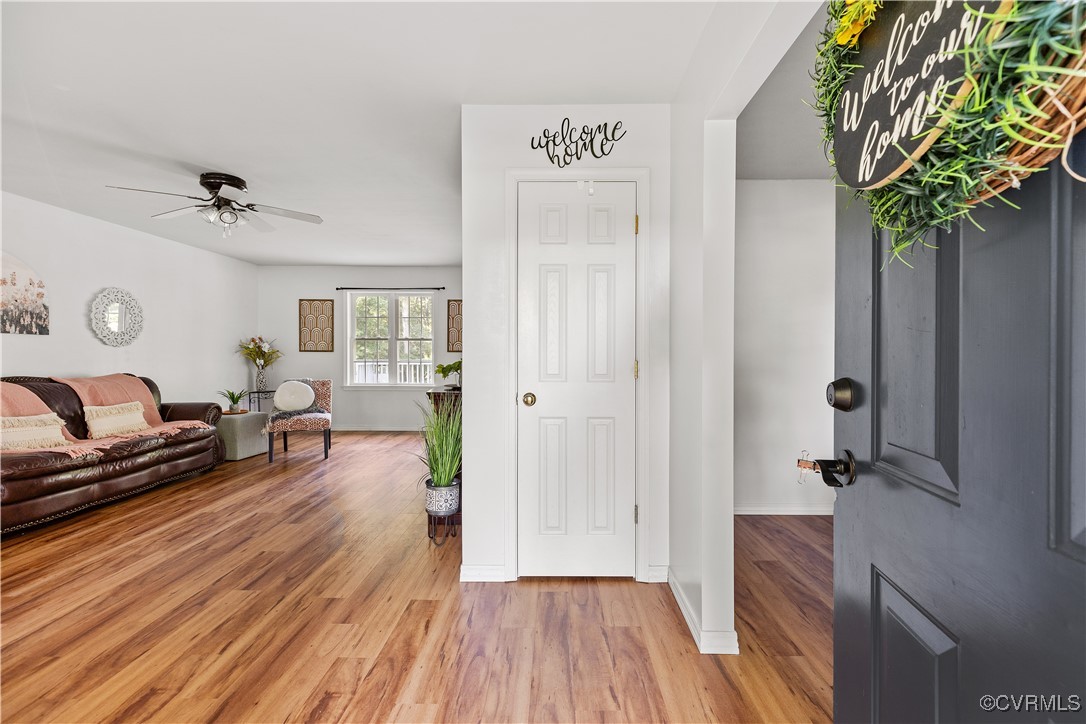 Entryway featuring wood-type flooring and ceiling