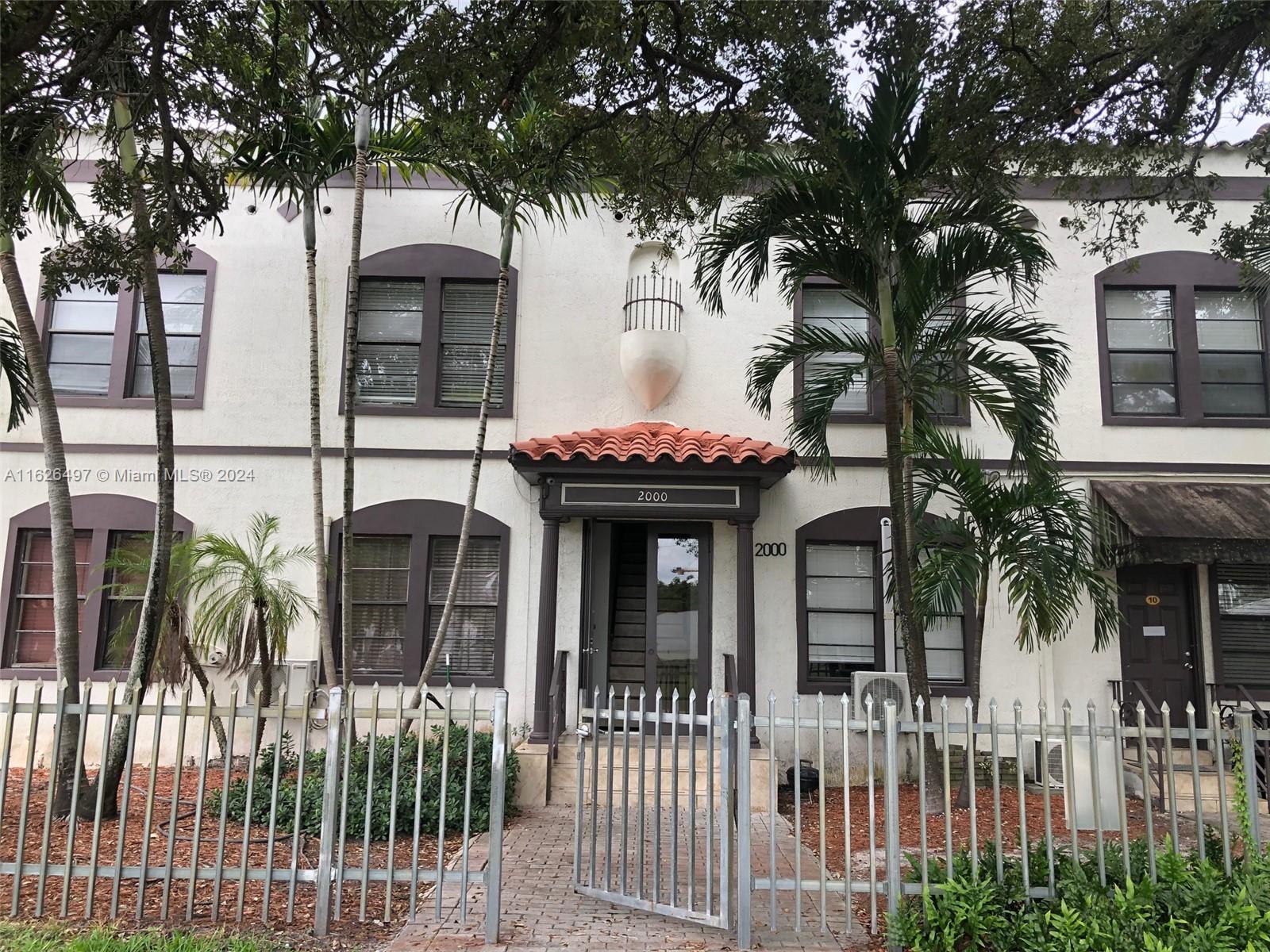 front view of house with a tree