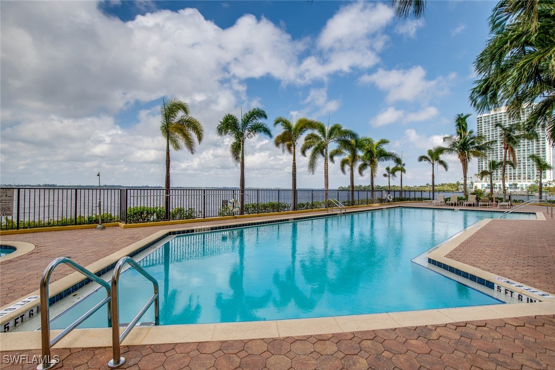 a view of swimming pool with outdoor seating