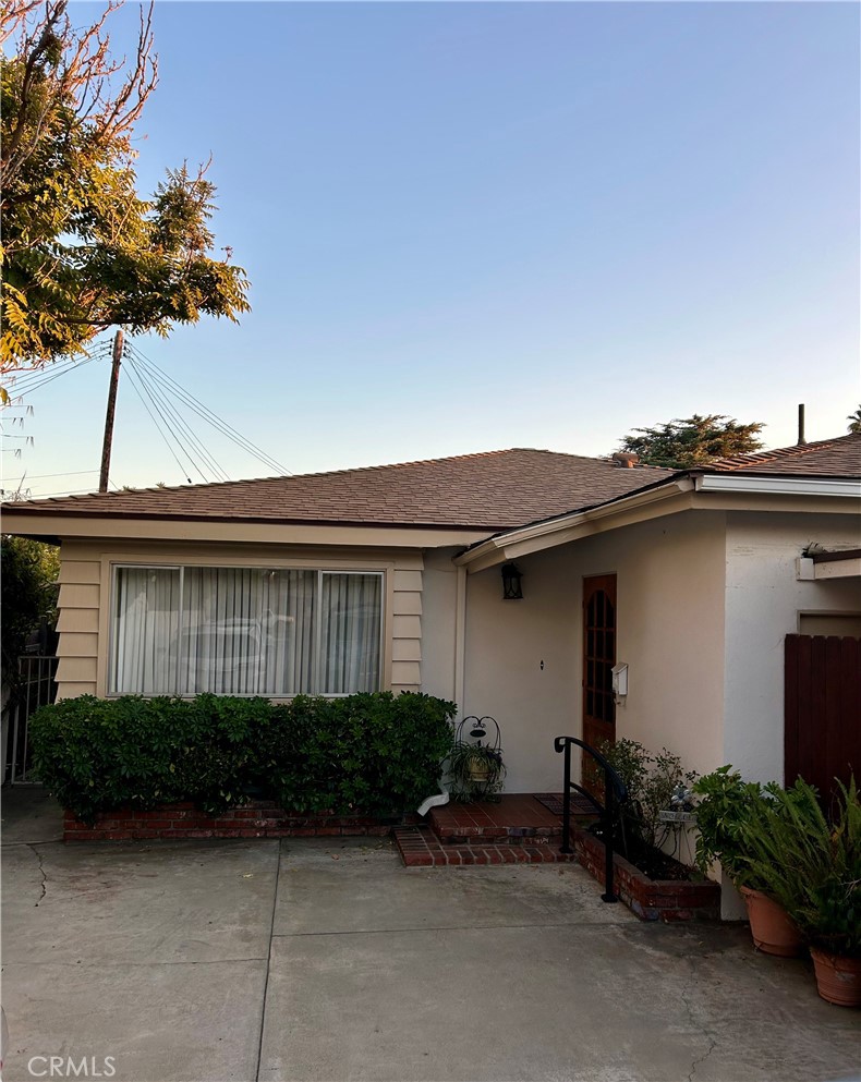 a house view with a garden space