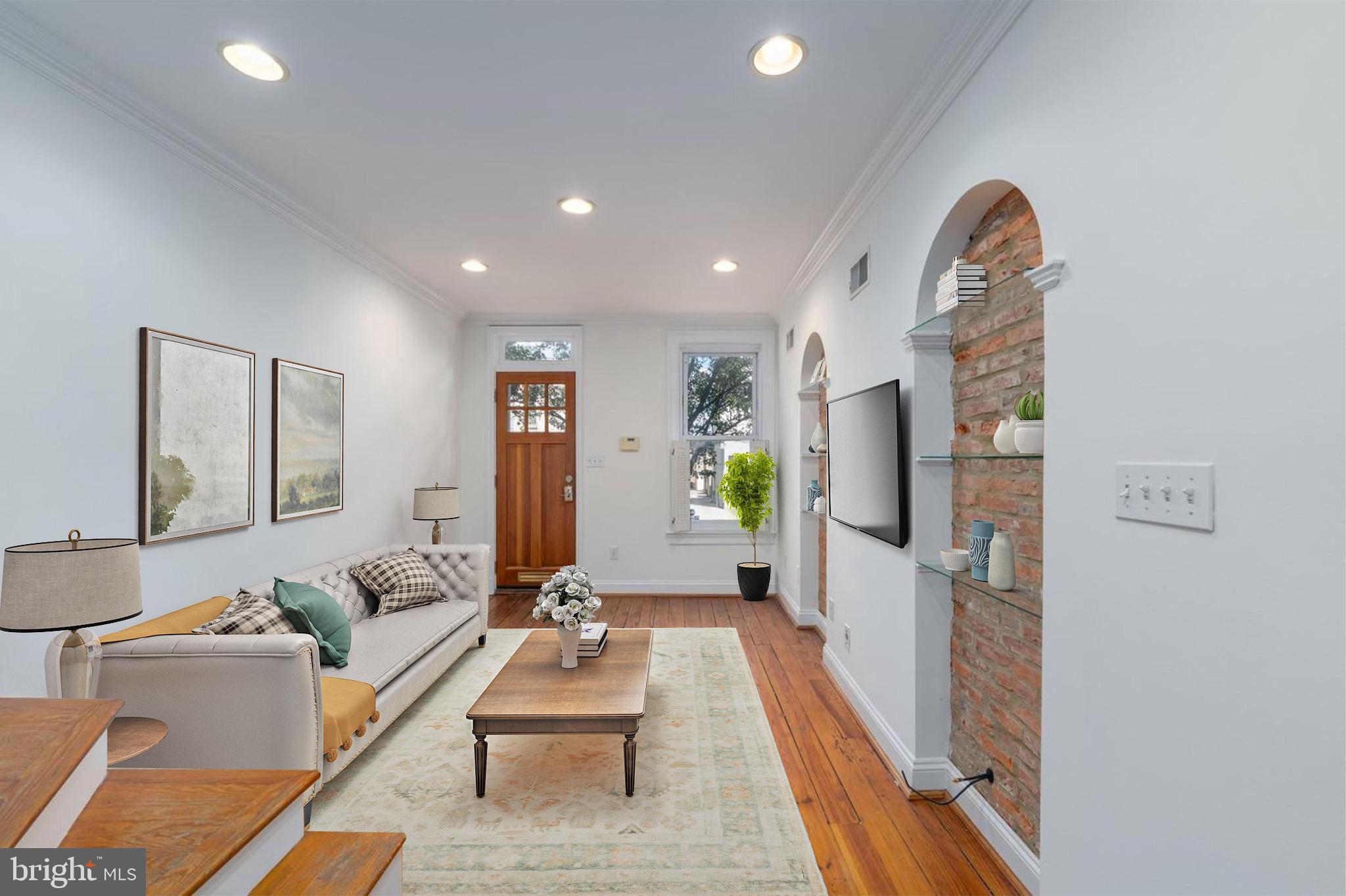 a living room with furniture and a flat screen tv