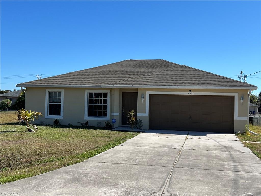 Ranch-style house with a front lawn