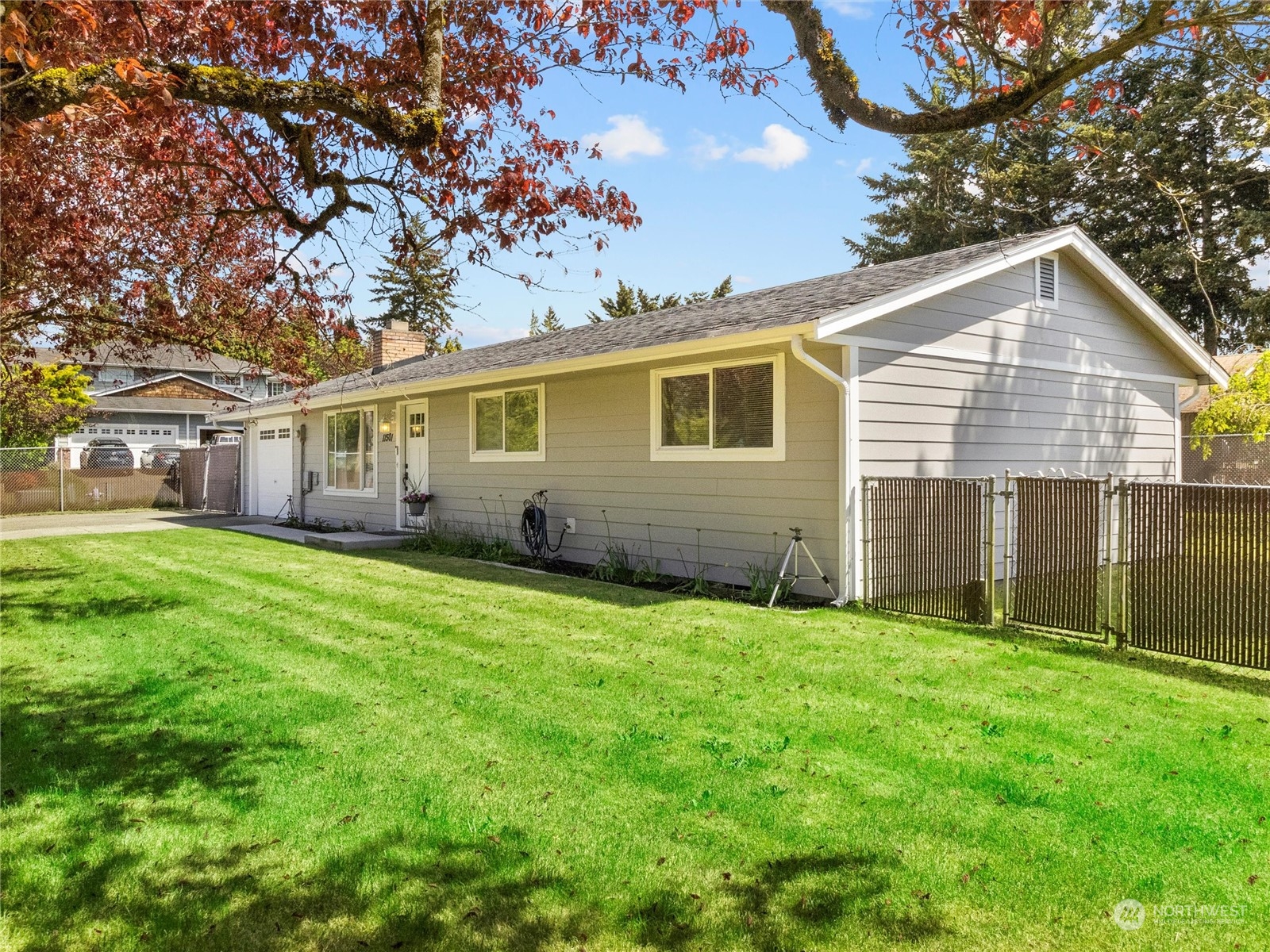 a view of a house with a yard