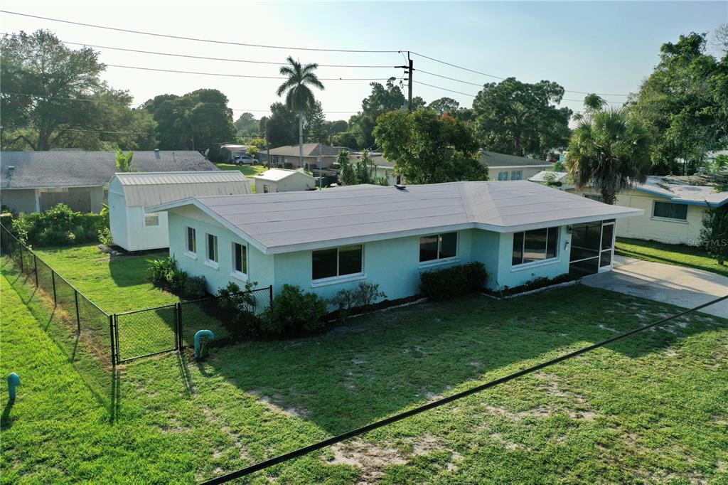 a aerial view of a house with a yard