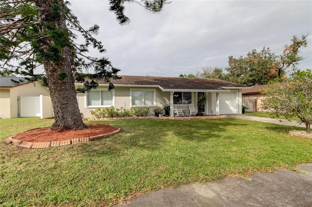 a view of a house with a yard