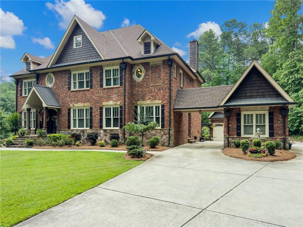 a front view of a house with garden