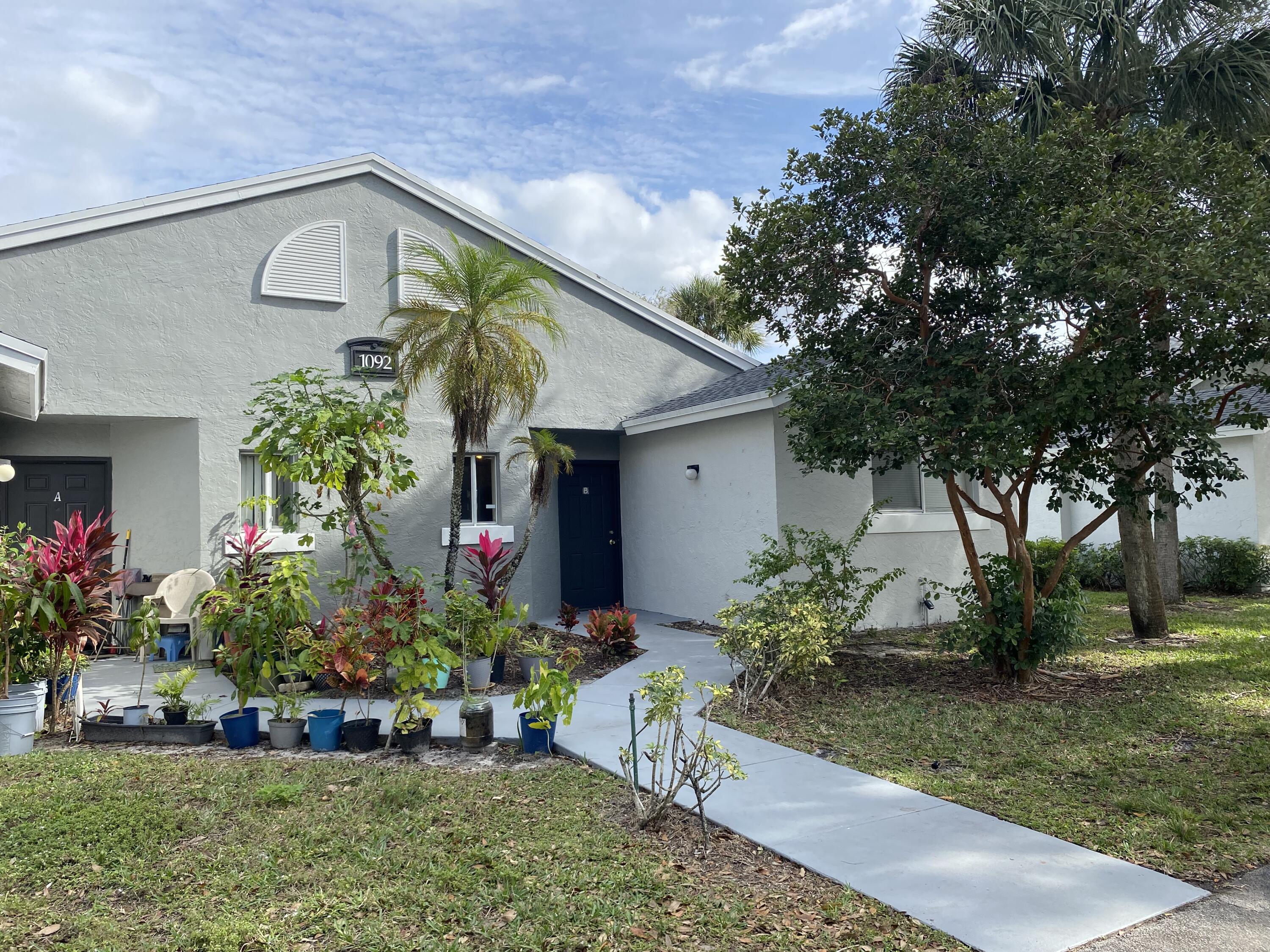 a front view of house with a yard