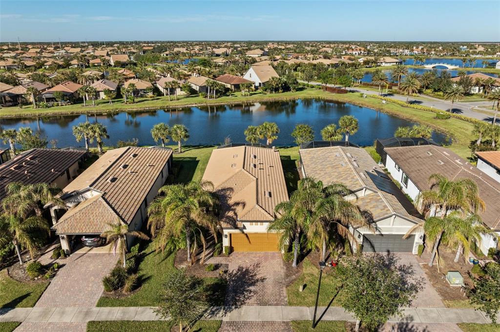 an aerial view of a house with a lake view