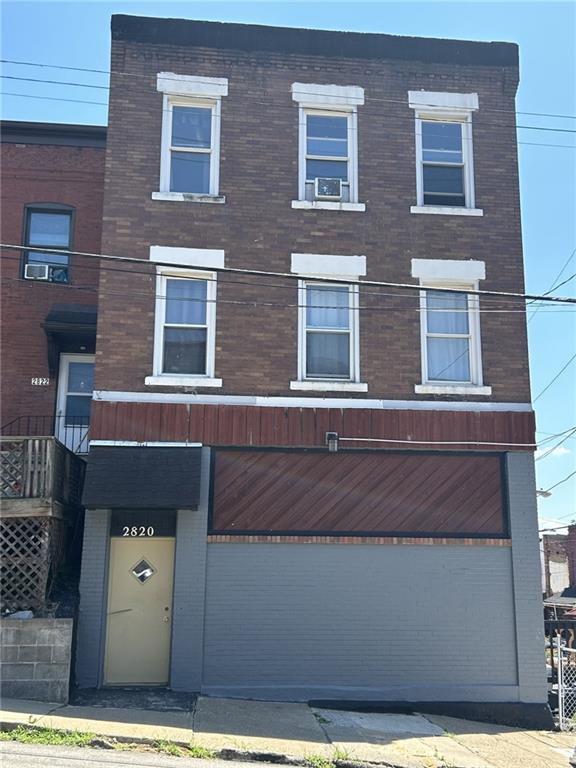 a front view of a house with parking