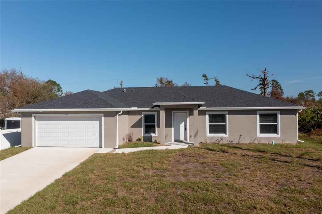 front view of a house with a yard