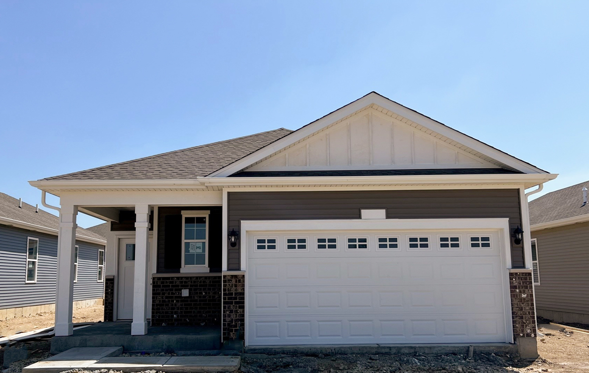 a front view of a house with parking