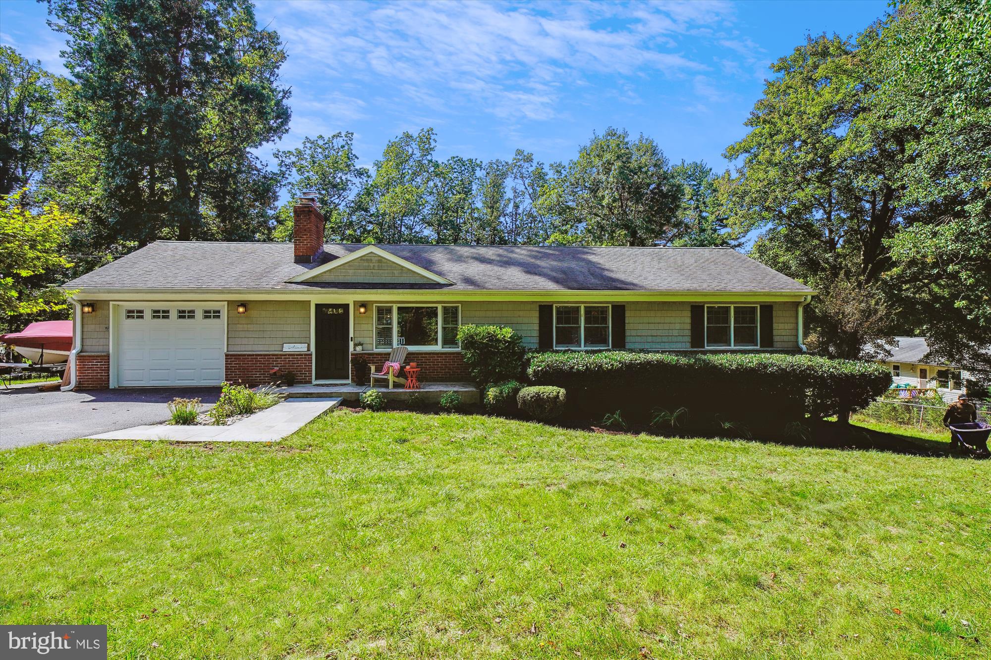 a view of house with outdoor seating and yard