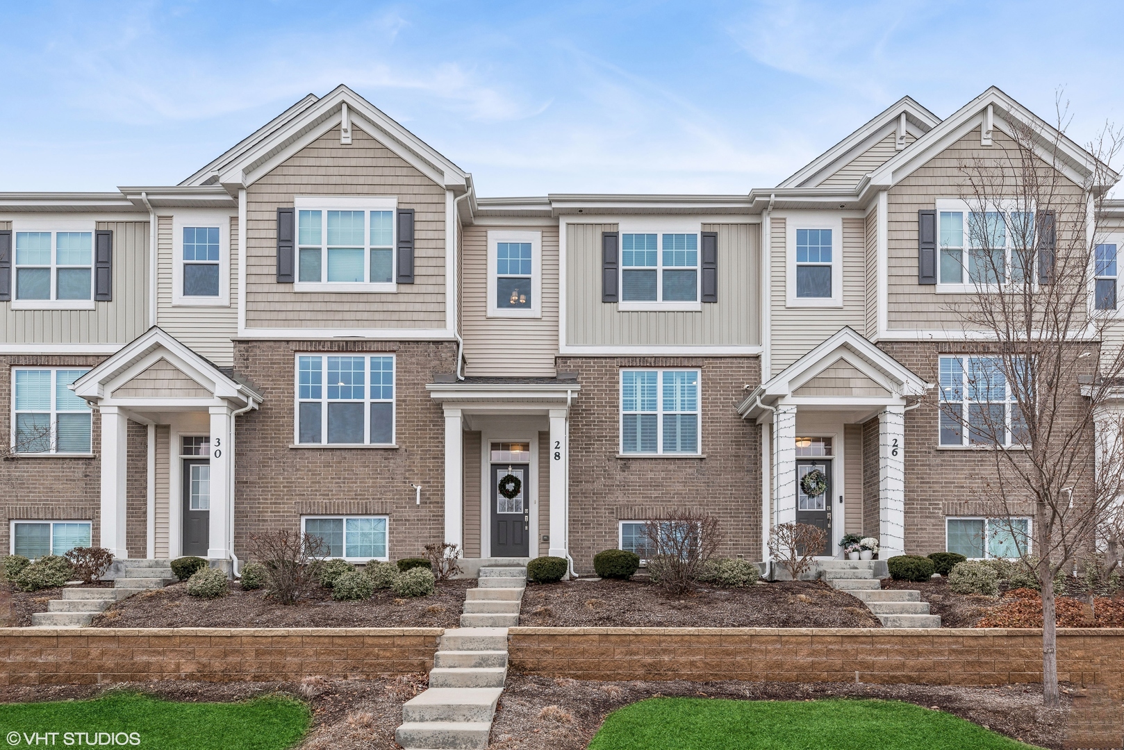 a front view of a house with a yard