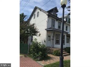 a view of a house with a small yard