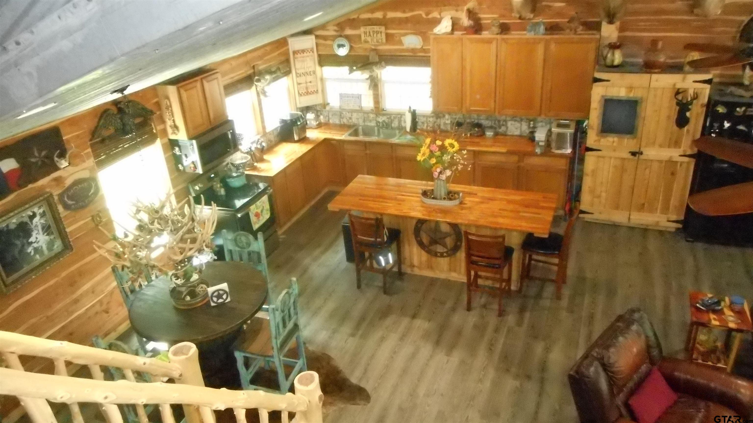 a dining room with furniture and wooden floor