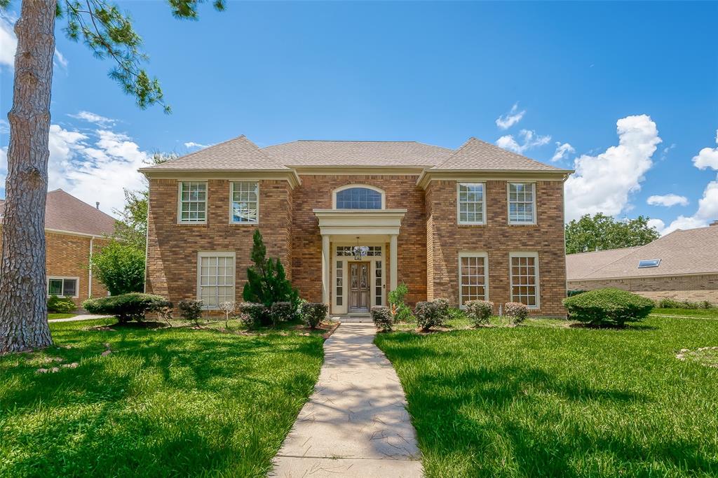 Welcome to this charming two-story brick exterior house, where classic elegance meets modern comfort. The striking brick façade is complemented by a lush green lawn at the front, creating an inviting first impression.