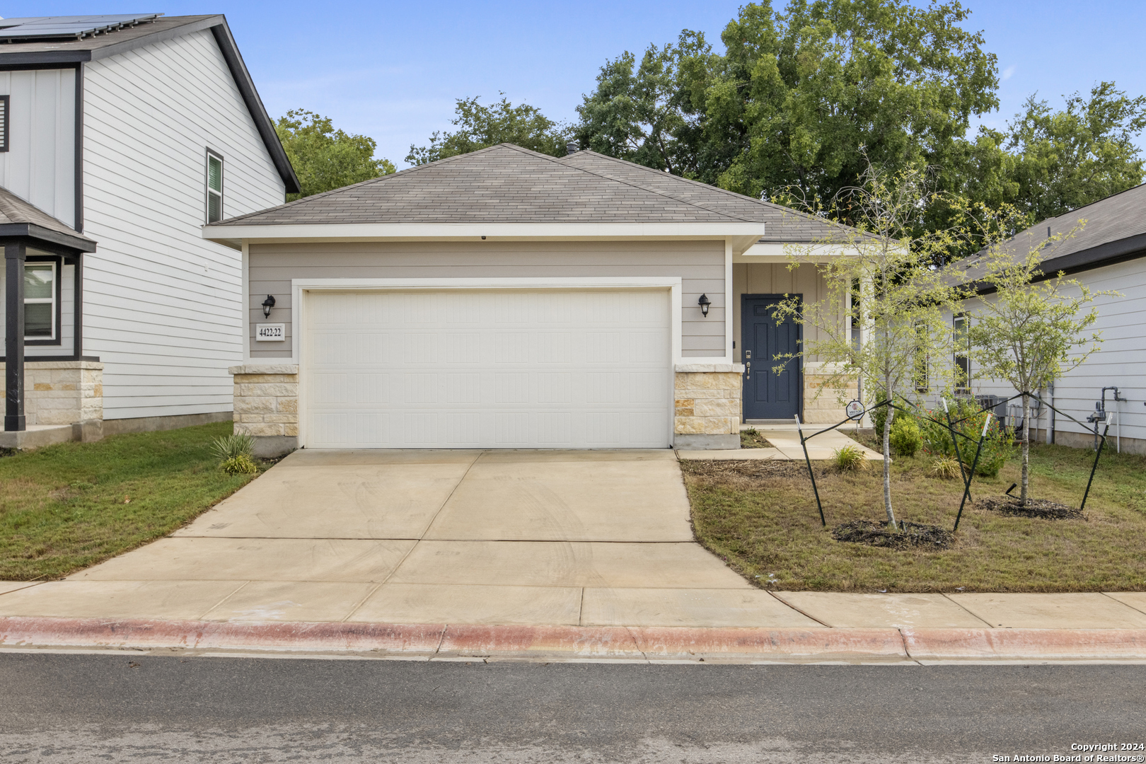 a front view of house with garage and yard