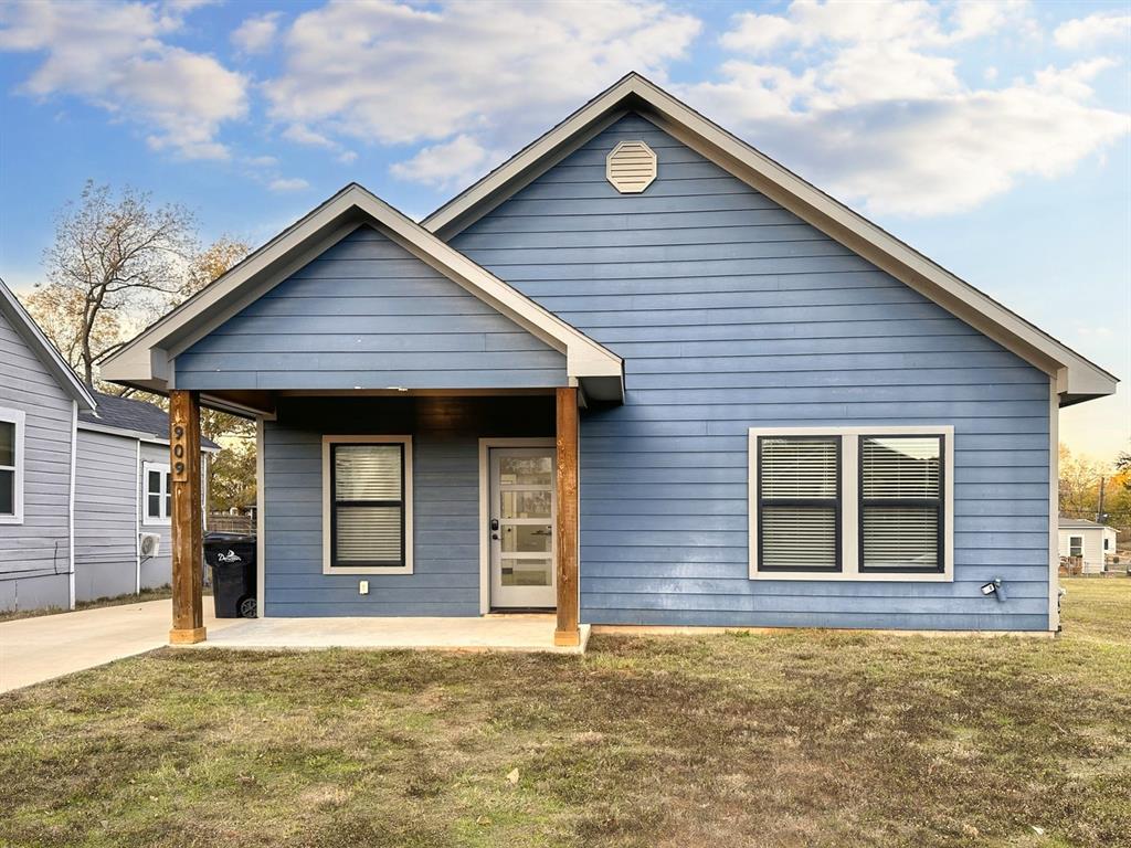 a front view of a house with garage