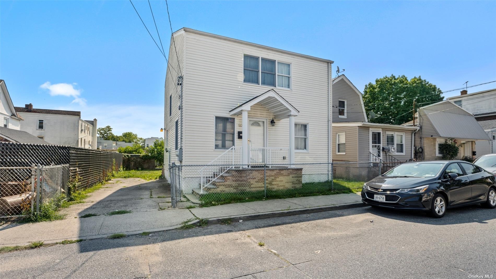 a view of a car parked in front of a house