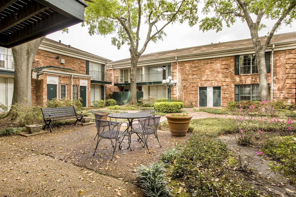 a backyard of a house with outdoor seating