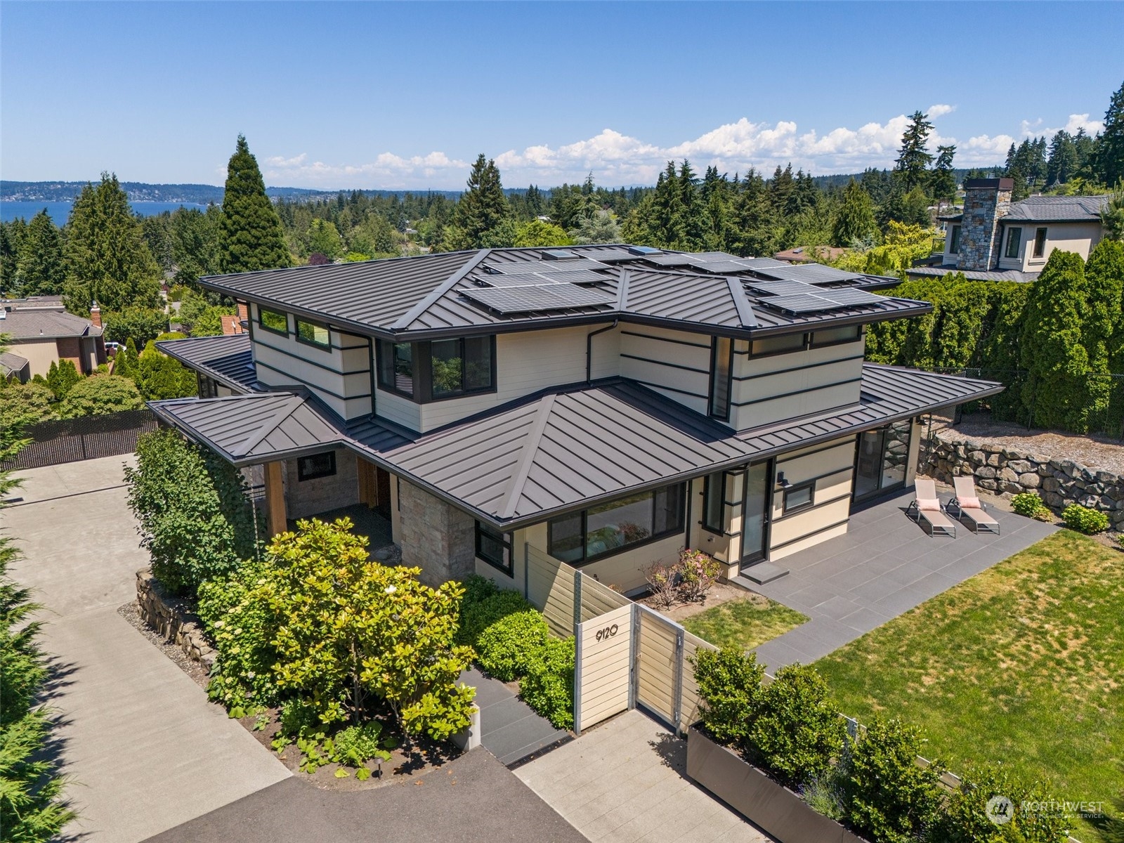 an aerial view of a house with a garden and plants