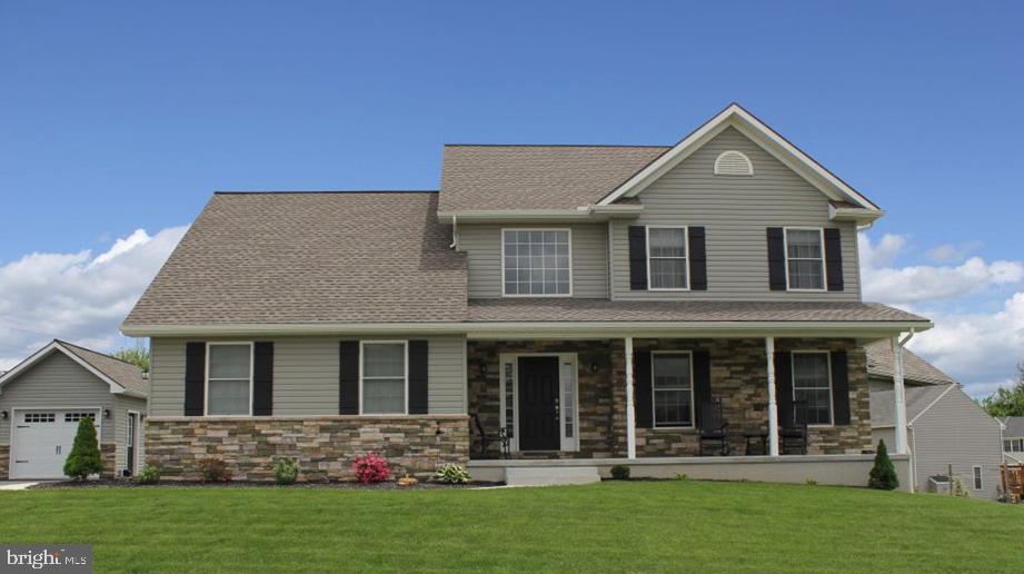 front view of a house with a yard