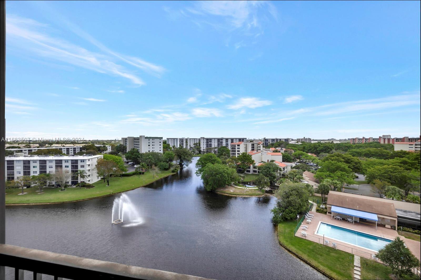 a view of a lake with a yard