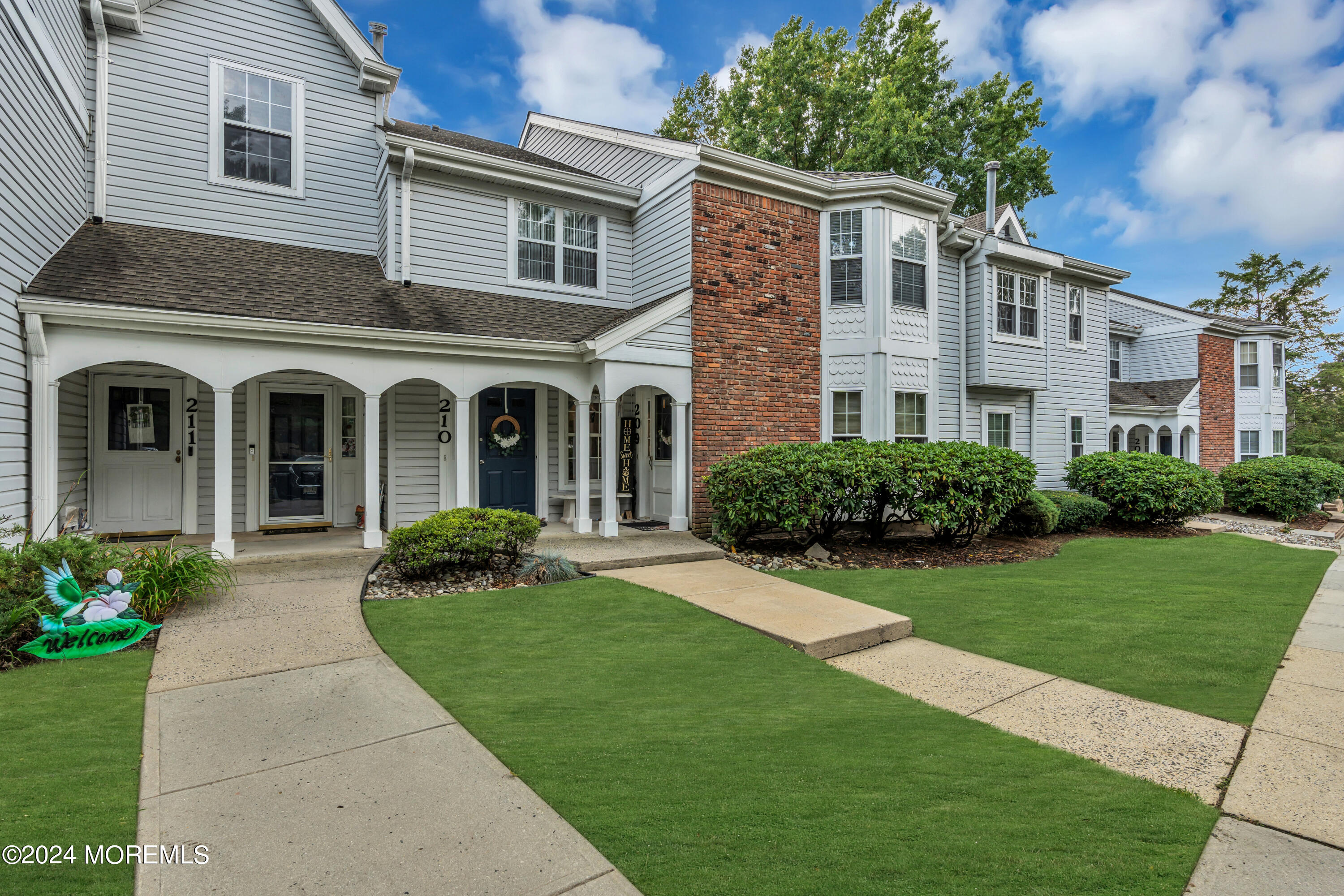 a front view of a house with garden