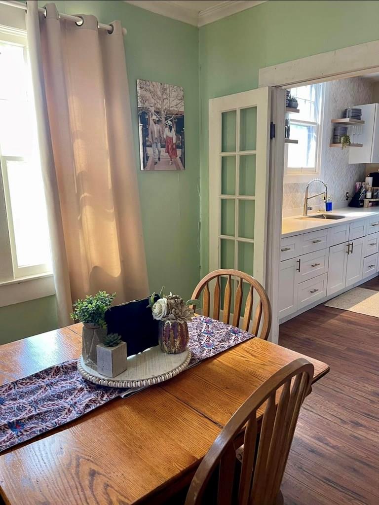 a dining room with furniture and window