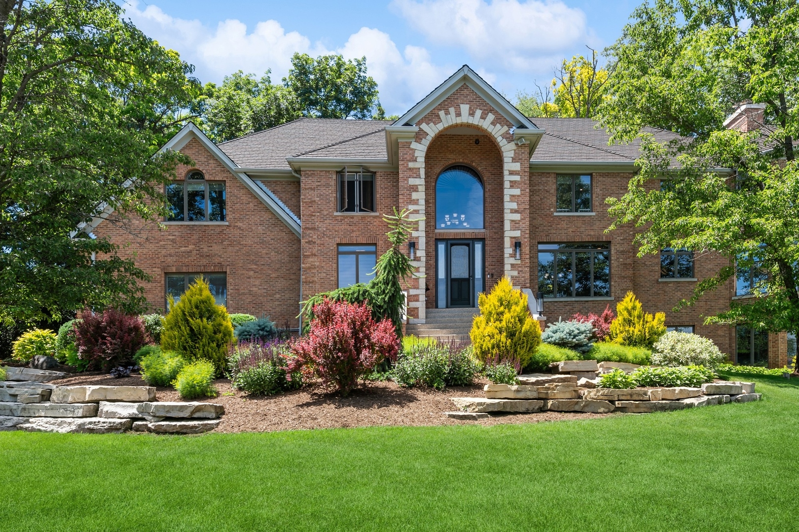 a front view of house with yard and green space