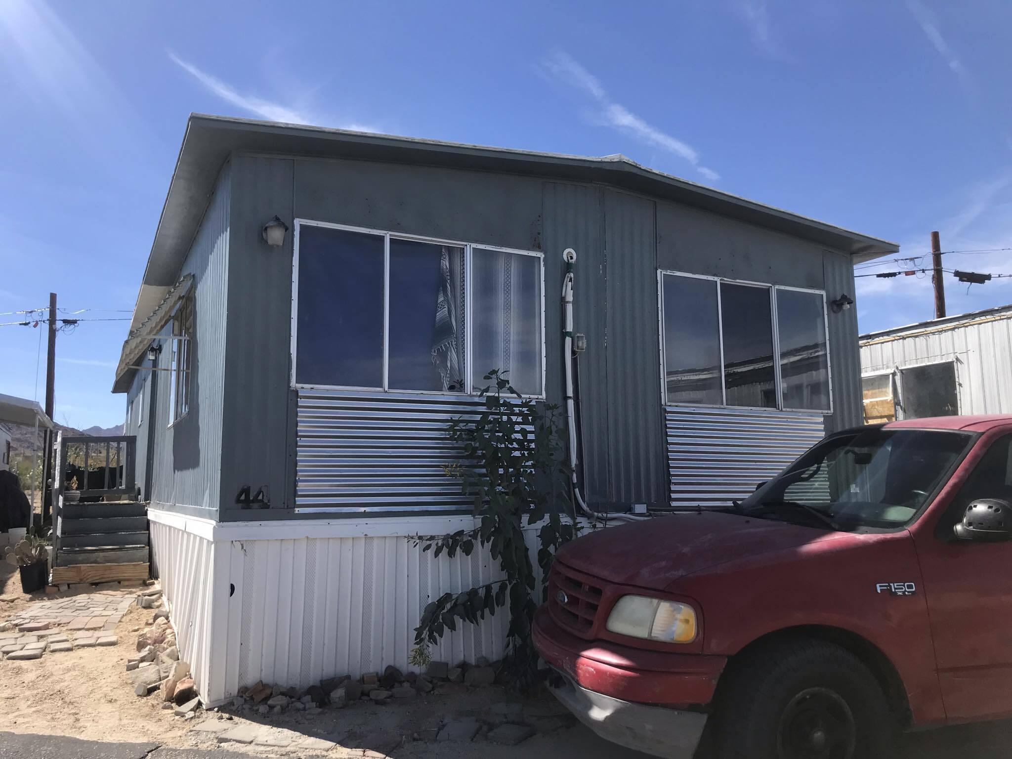 a front view of a house with parking space