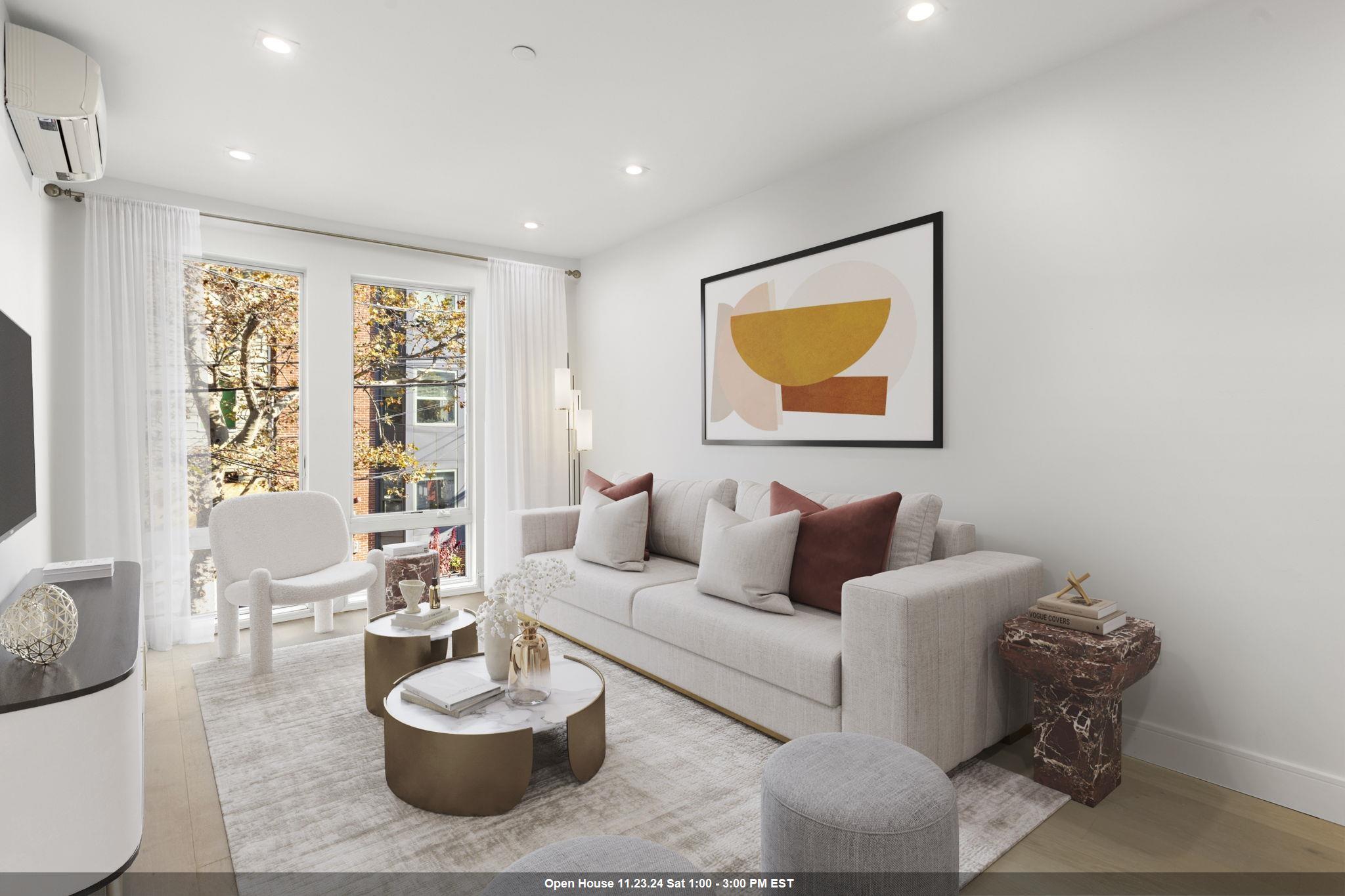 a living room with furniture and a potted plant