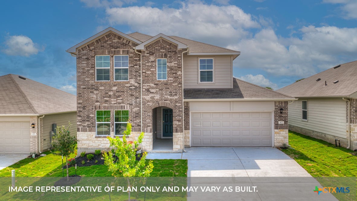 a view of house with garden and entertaining space