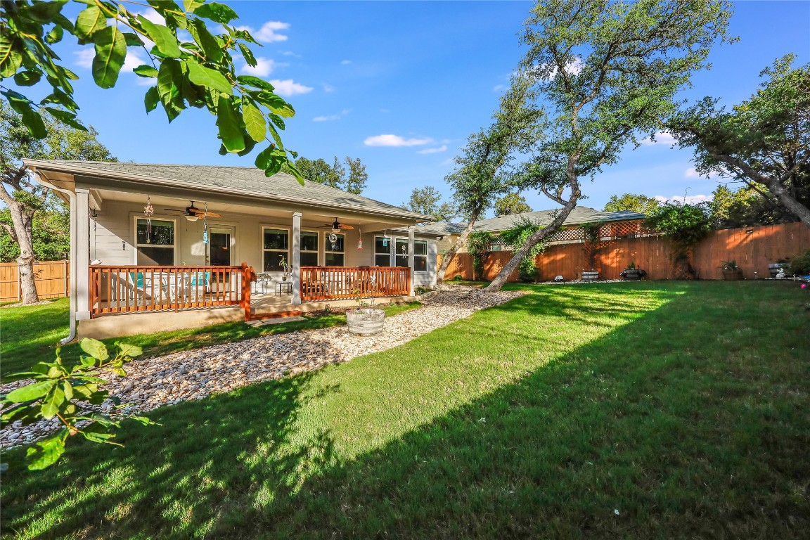 a view of a house with a backyard porch and sitting area