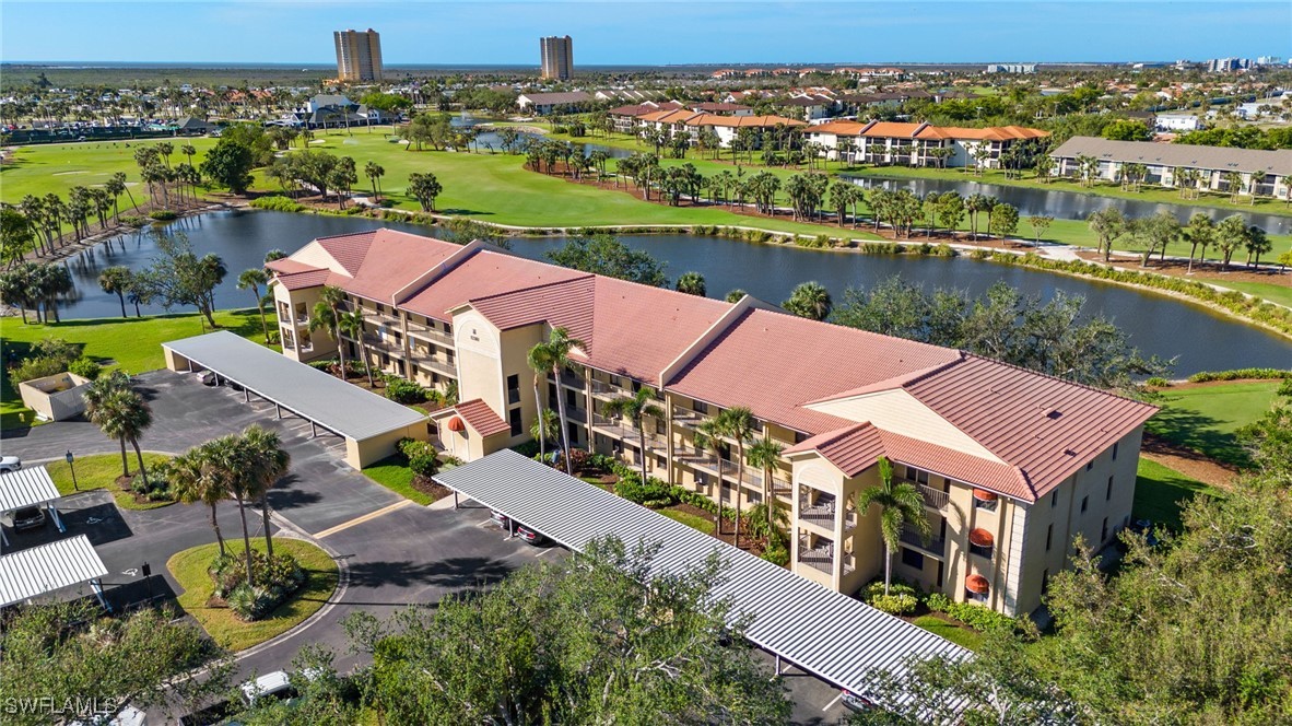 an aerial view of a house with a lake view