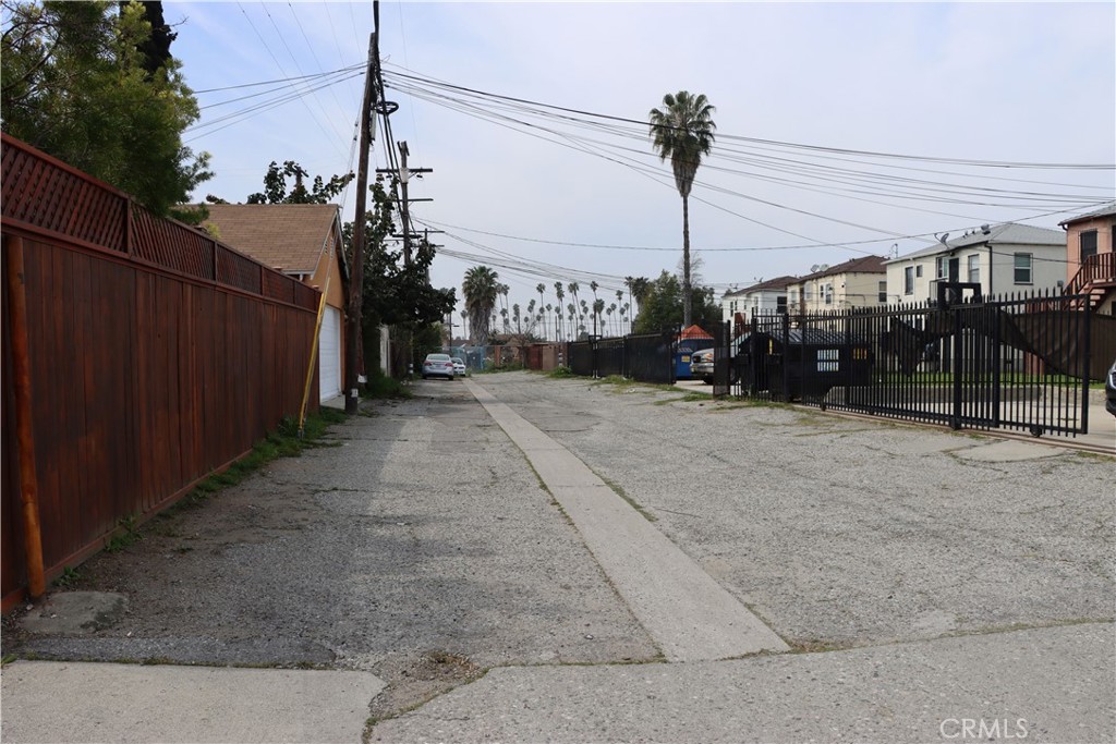 a view of a street with a car park side