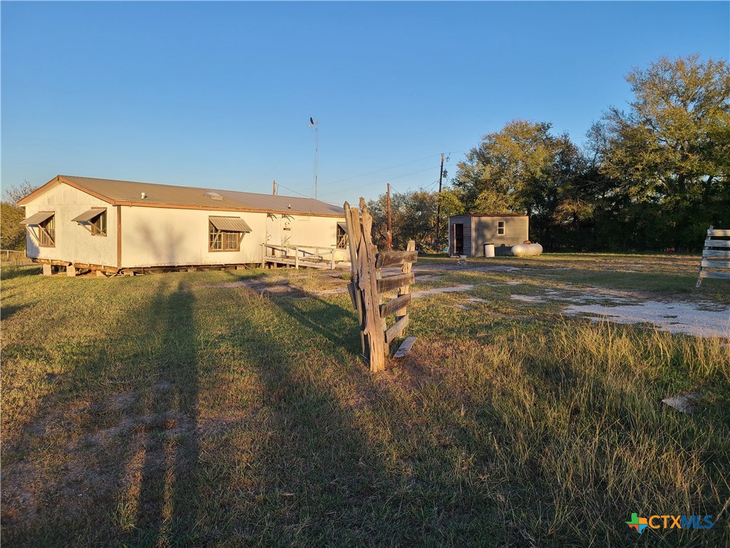 a view of a street with a yard