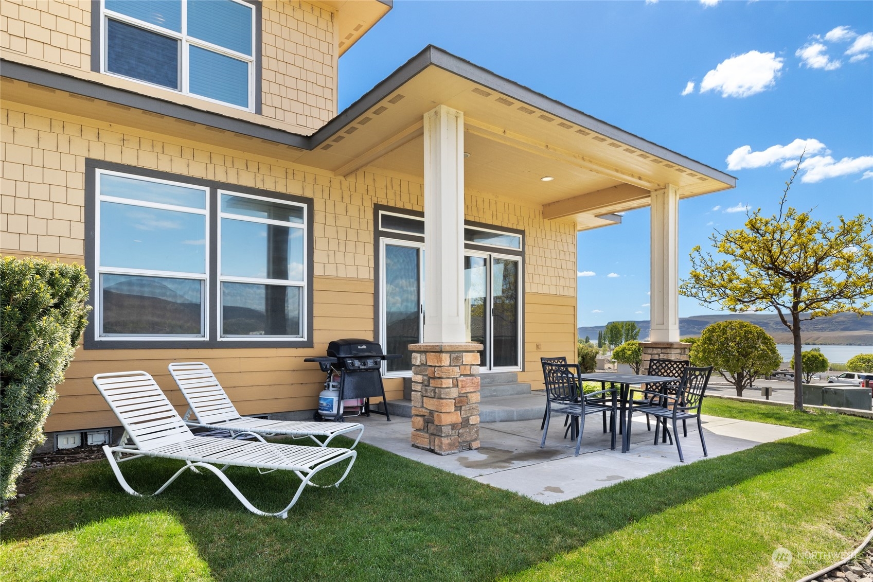 a building outdoor space with patio furniture and outdoor seating