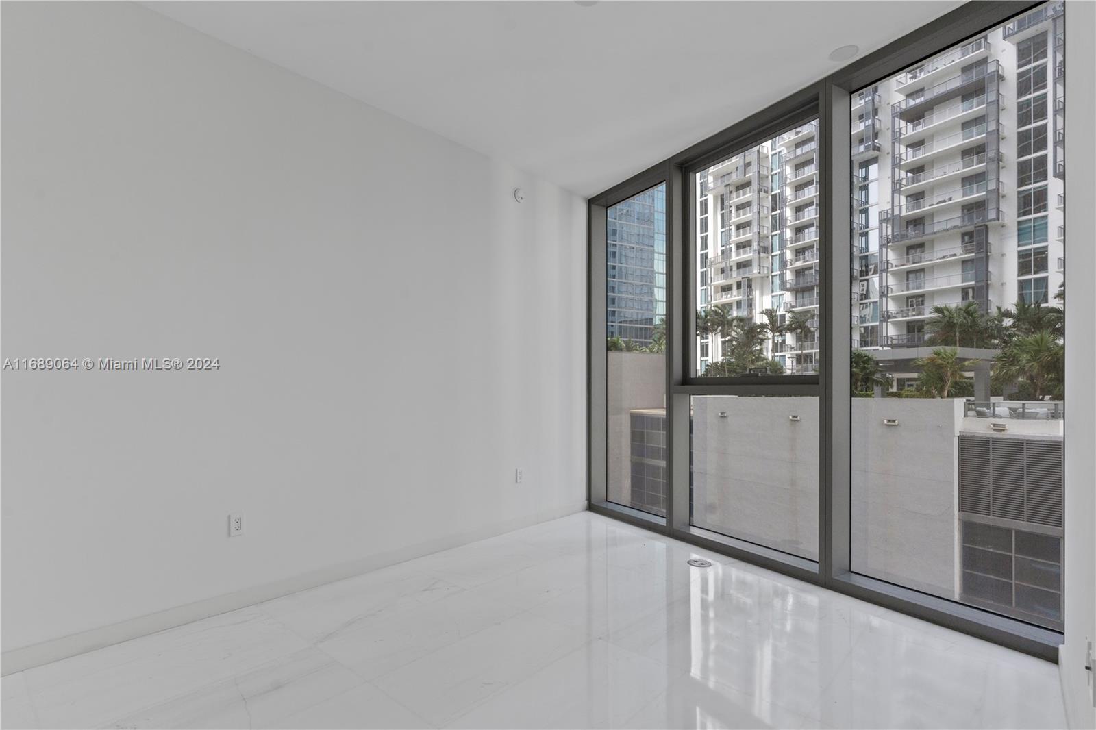 a view of an empty room and window