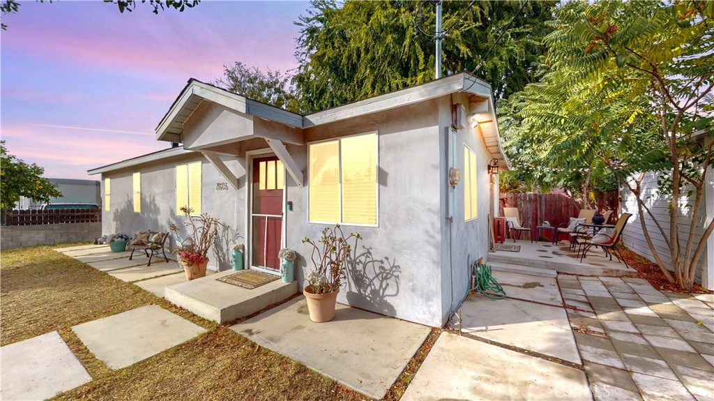 a front view of a house with outdoor seating