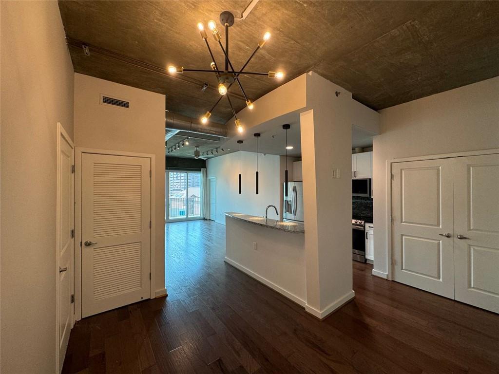 a view of a livingroom with wooden floor