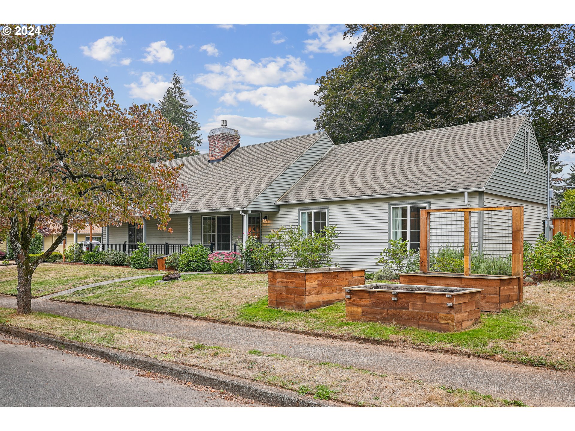 a front view of house with yard and green space