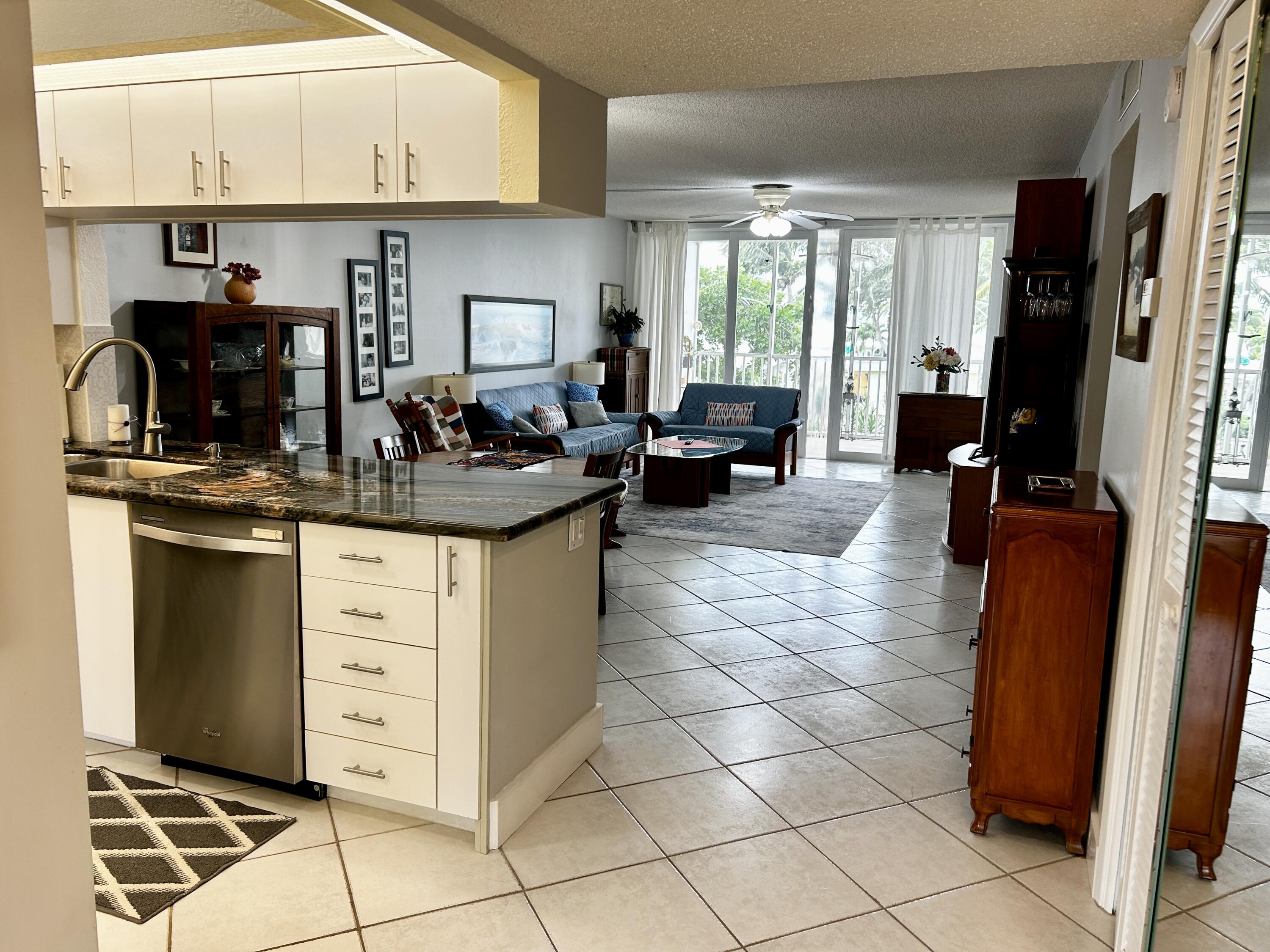 a kitchen with appliances cabinets and furniture