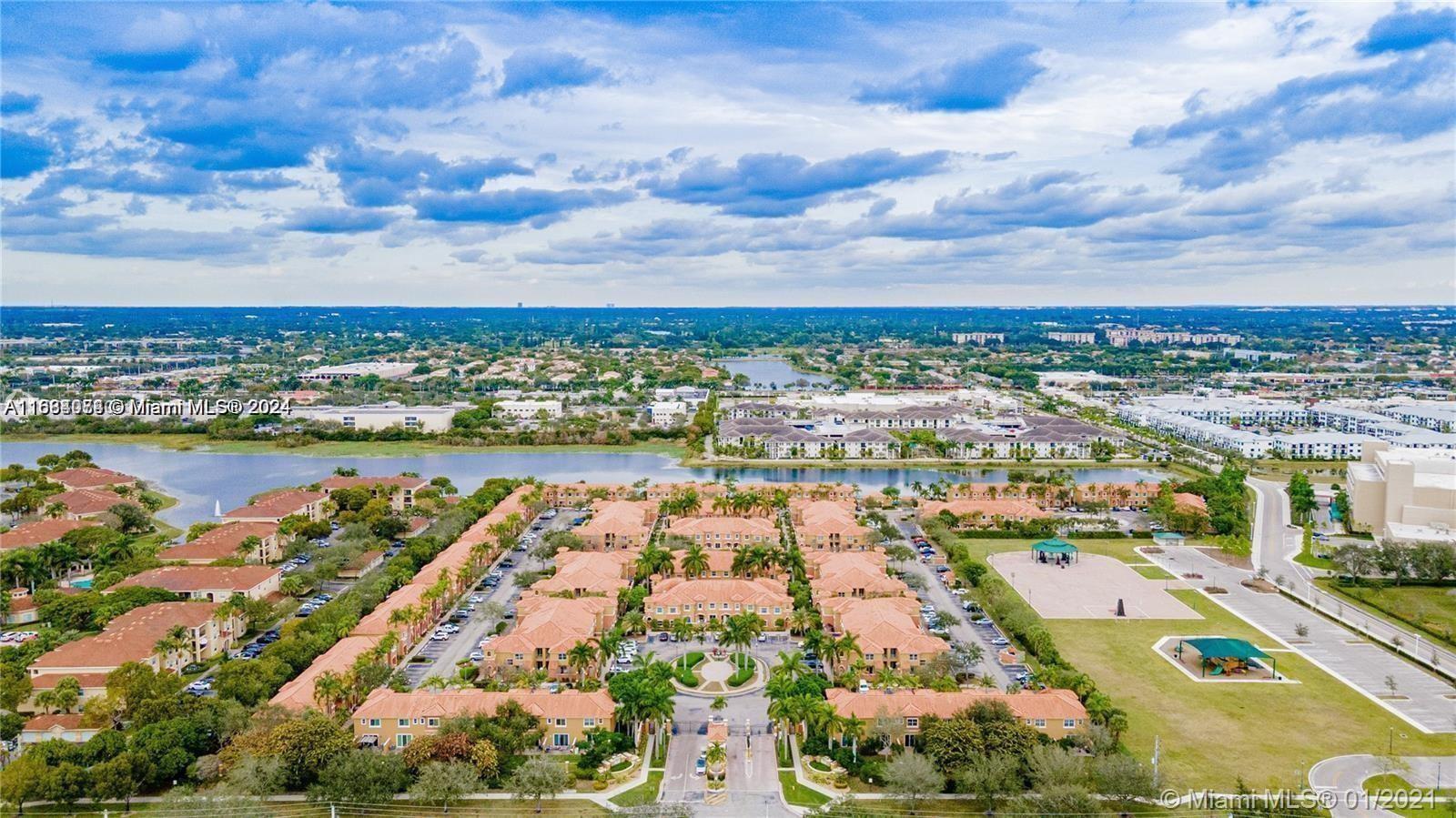 an aerial view of residential building and lake view