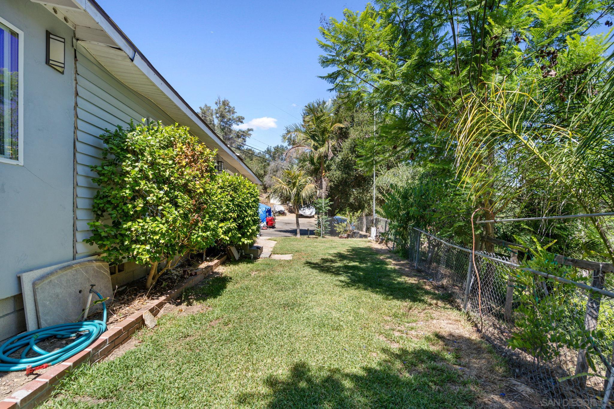 a backyard of a house with lots of green space