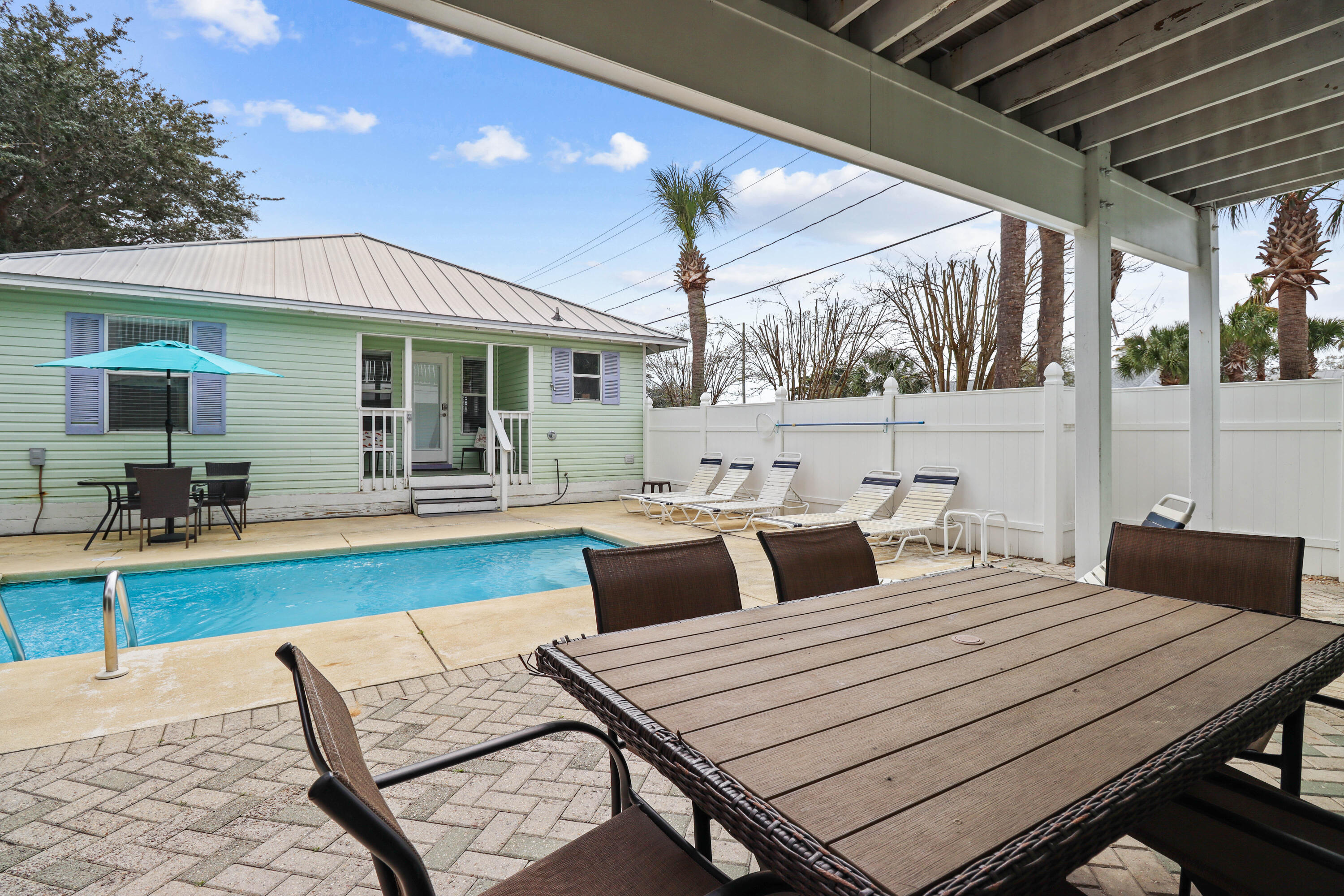 a front view of a house with outdoor seating