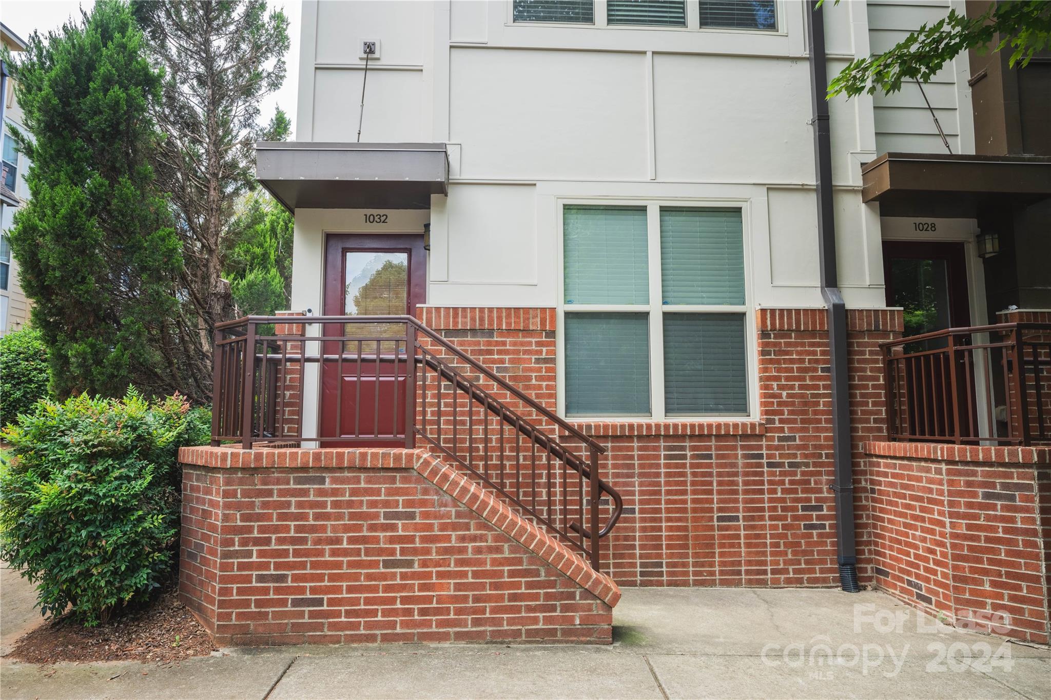 a brick building with a door and a window