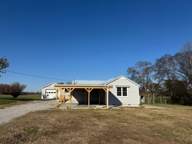 a front view of a house with parking yard