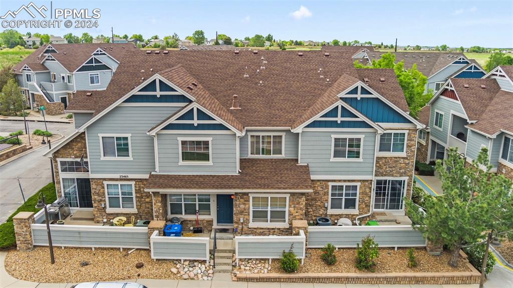 a aerial view of a house with a garden and plants