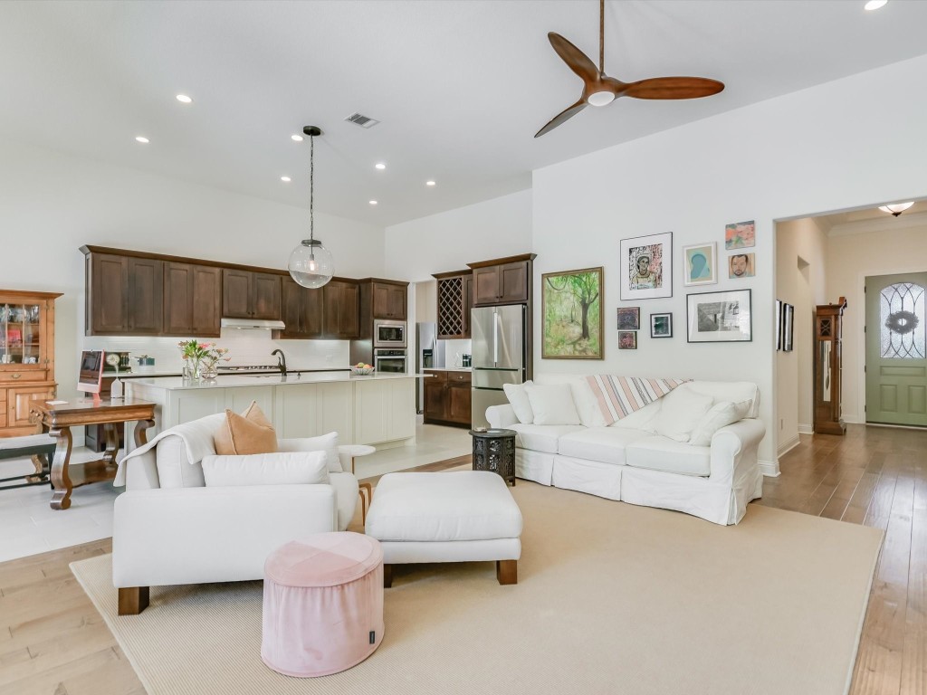 a living room with furniture and kitchen view